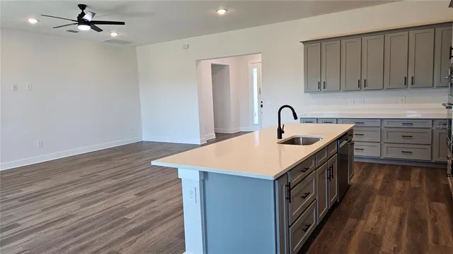 a kitchen with a stove a sink and dishwasher