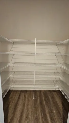 a view of a room with stairs and a floor to ceiling window