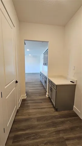 a view of room with wooden floor