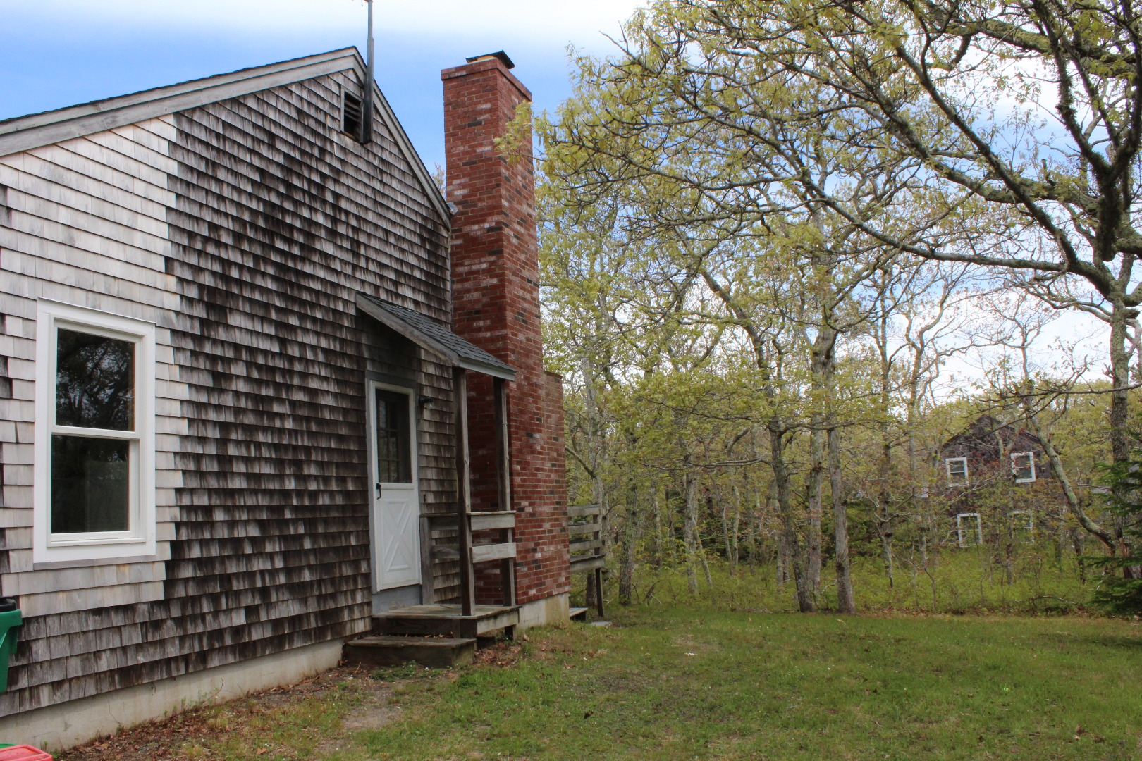 5 Pamela Way Edgartown, MA 02539 - Photo 3 of 12 a view of backyard with barbeque grill and a large tree