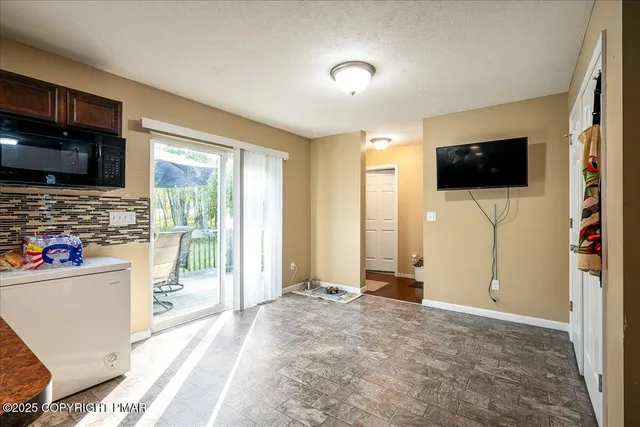 a view of a livingroom with shelves