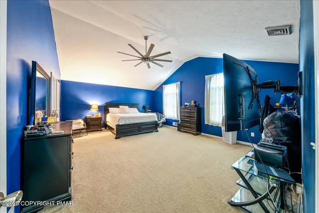 a view of a livingroom with furniture and a chandelier