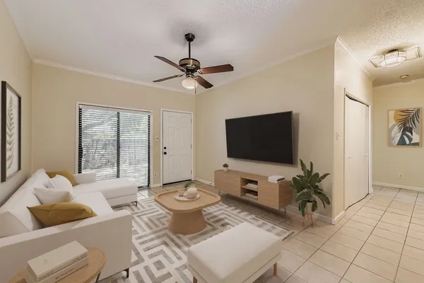 a living room with furniture and a flat screen tv