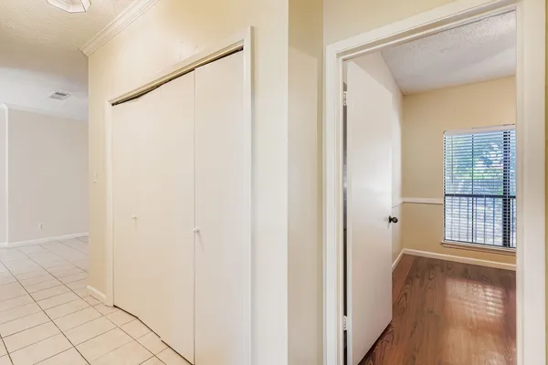 a view of front door with wooden floor