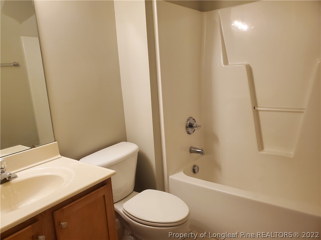 11 Sawtooth Oak Circle Bunnlevel, NC 28323 - Photo 7 of 16 a bathroom with a sink a toilet and shower