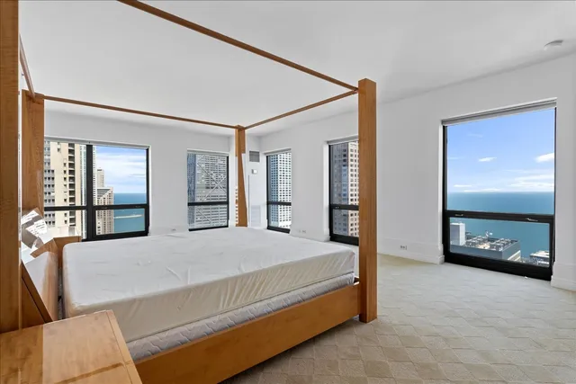 a large bathroom with a large mirror vanity and a sink