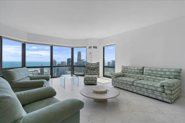 a living room with furniture and a large window