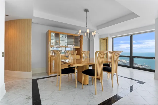 a view of a dining room with furniture window and outside view