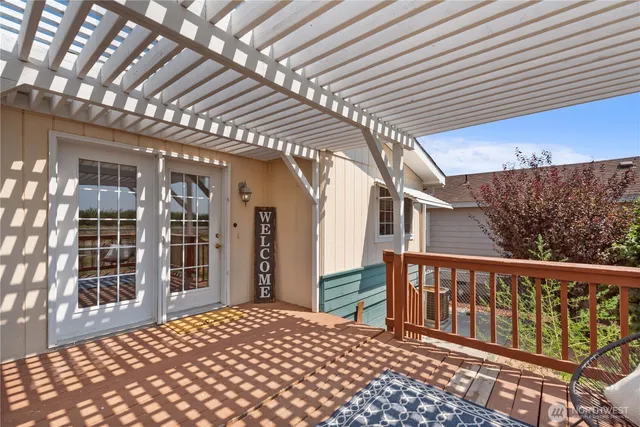 a living room with furniture a rug and a window