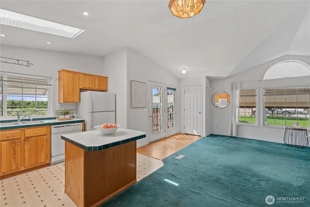 a kitchen with a sink and a refrigerator