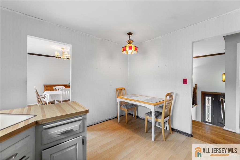 33 Prospect Lane Colonia, NJ 07067 - Photo 12 of 35 a room with a table and chairs