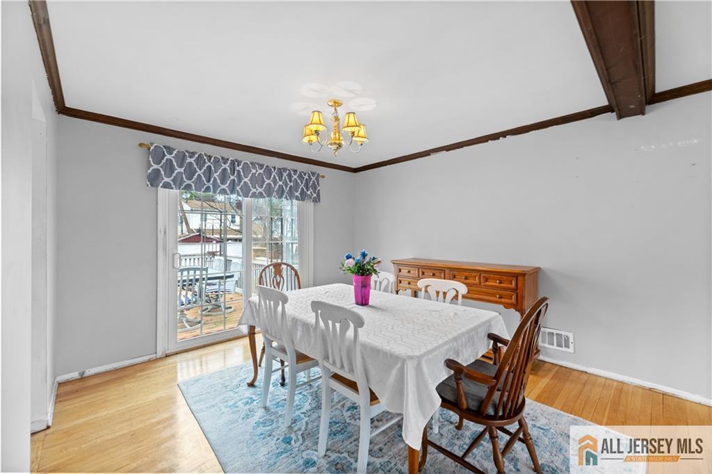 33 Prospect Lane Colonia, NJ 07067 - Photo 14 of 35 a view of a dining room with furniture and a window