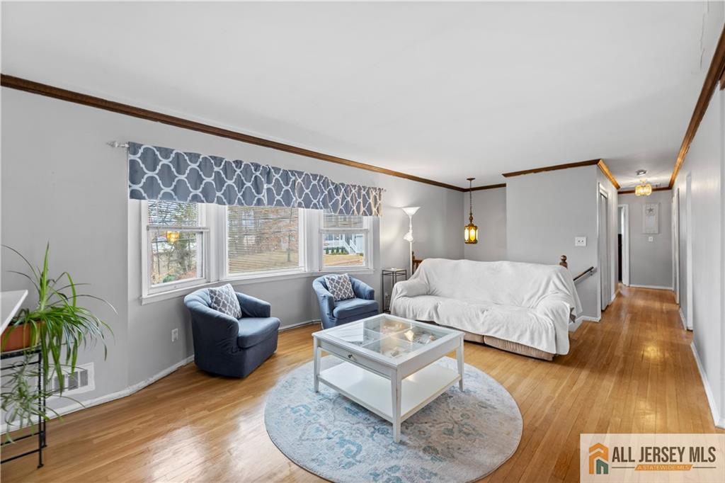 33 Prospect Lane Colonia, NJ 07067 - Photo 15 of 35 a living room with furniture and a large window