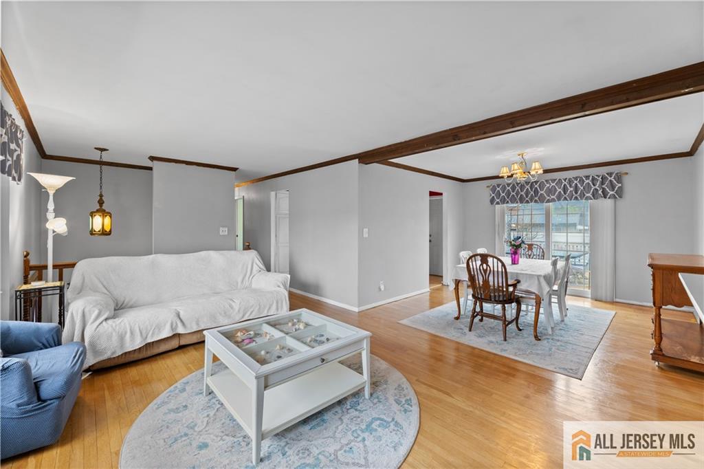 33 Prospect Lane Colonia, NJ 07067 - Photo 17 of 35 a living room with furniture and a large window