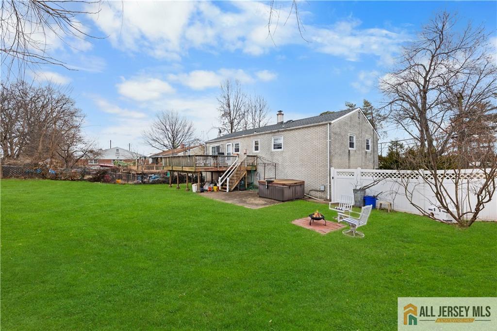 33 Prospect Lane Colonia, NJ 07067 - Photo 31 of 35 a view of a house with a big yard and sitting area