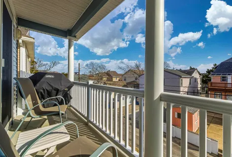 a view of a balcony with furniture