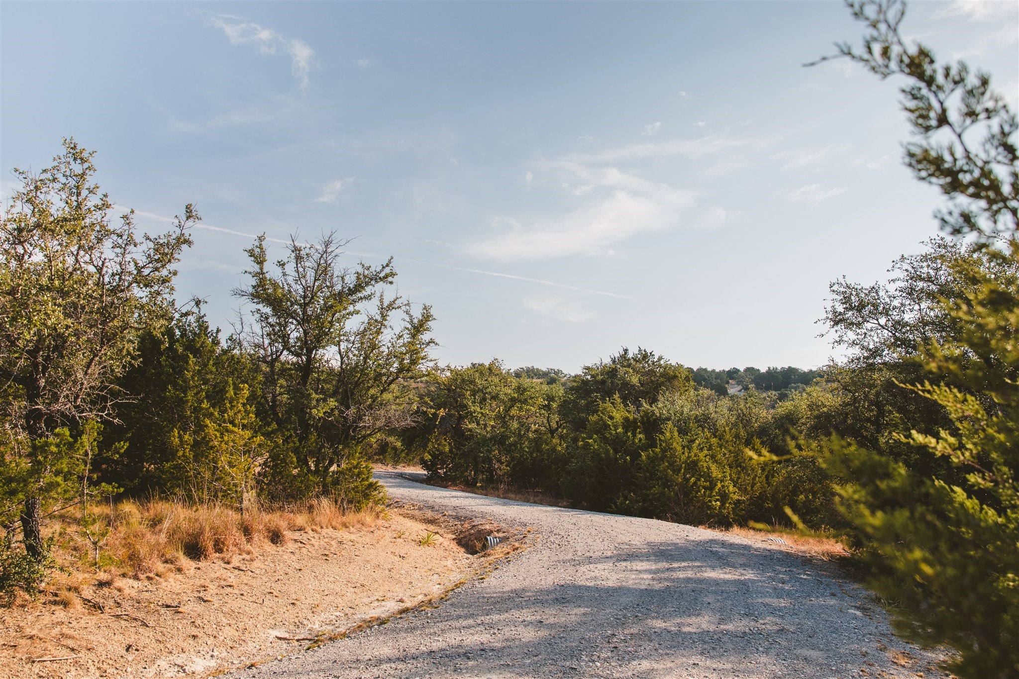 340 Ranch View Road Spicewood, TX 78669 - Photo 15 of 40 a view of a backyard of the house