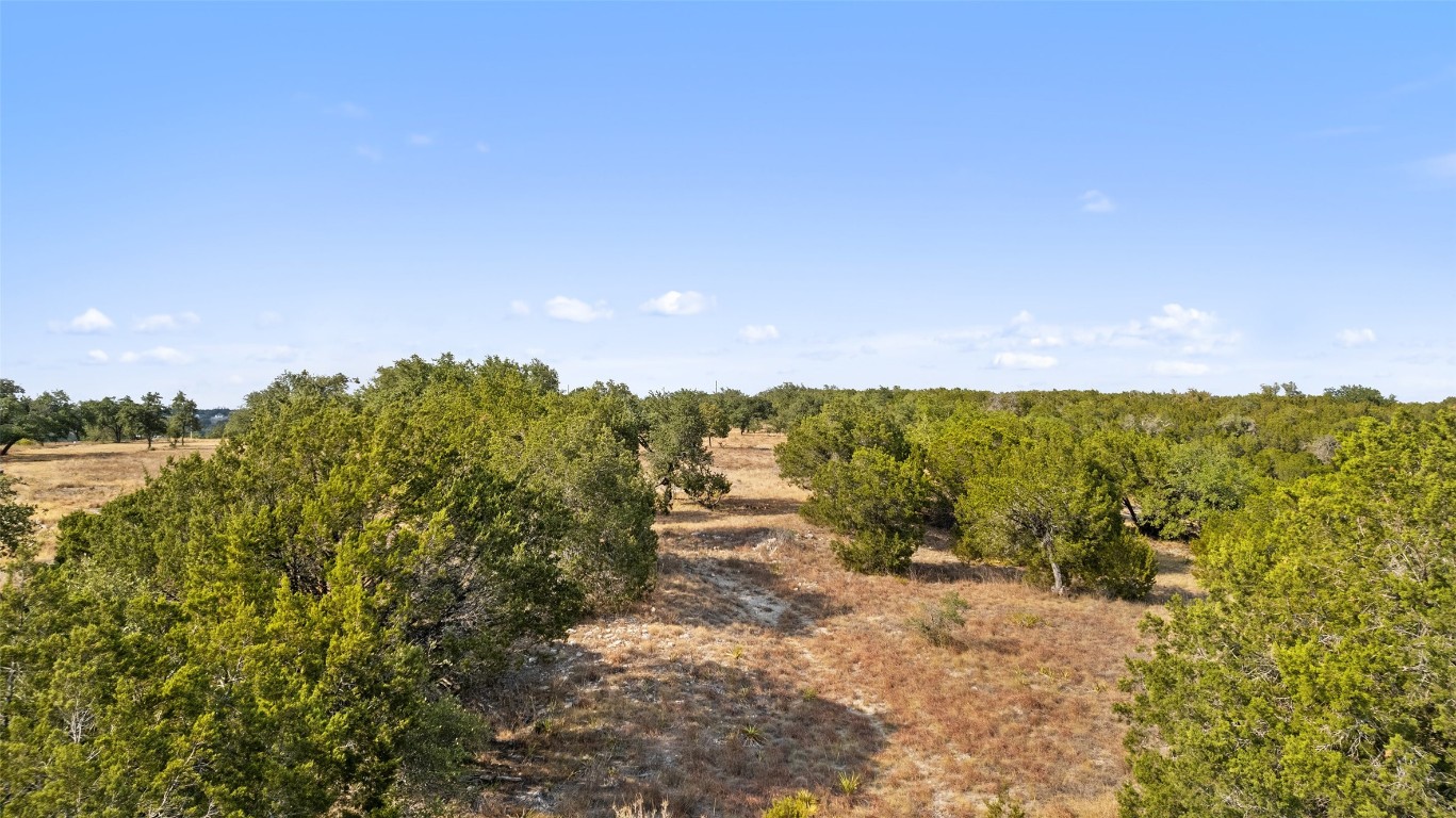340 Ranch View Road Spicewood, TX 78669 - Photo 38 of 40 a view of a lake with mountains in the background