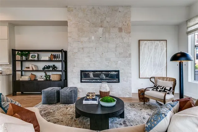 a living room with furniture and a fireplace