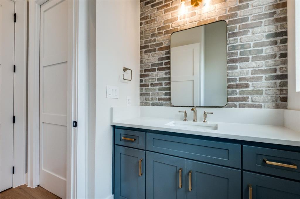 250 East Dallas Road, Unit 119 Grapevine, TX 76051 - Photo 21 of 40 a bathroom with a double vanity sink and a mirror