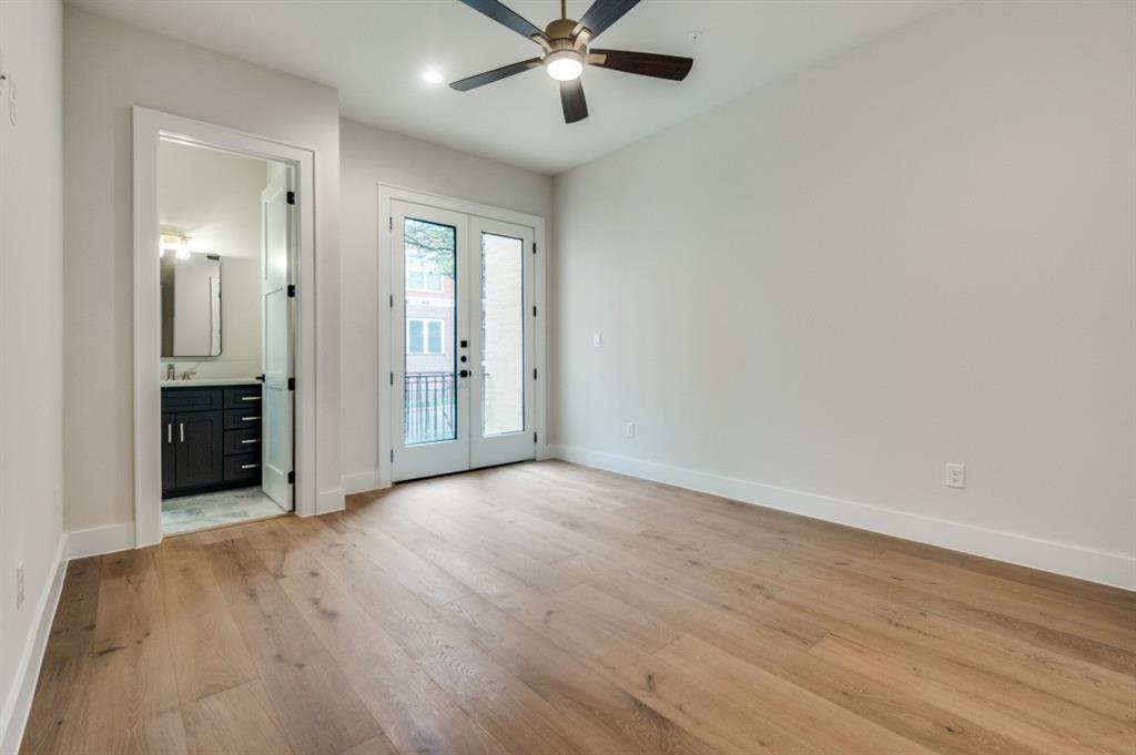 250 East Dallas Road, Unit 119 Grapevine, TX 76051 - Photo 5 of 40 wooden floor in an empty room with a window