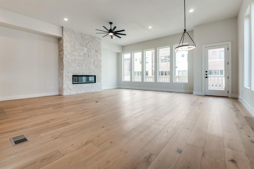 250 East Dallas Road, Unit 119 Grapevine, TX 76051 - Photo 10 of 40 a view of an empty room with glass door and windows