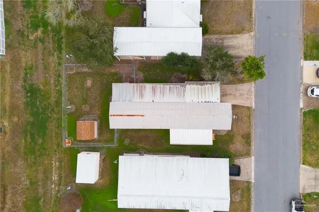 an aerial view of a house with a garden