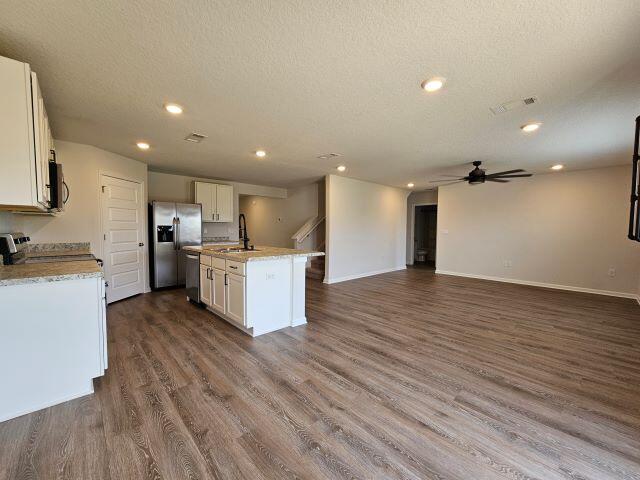 320 Flounder Street Crestview, FL 32539 - Photo 13 of 41 a view of kitchen with wooden floor