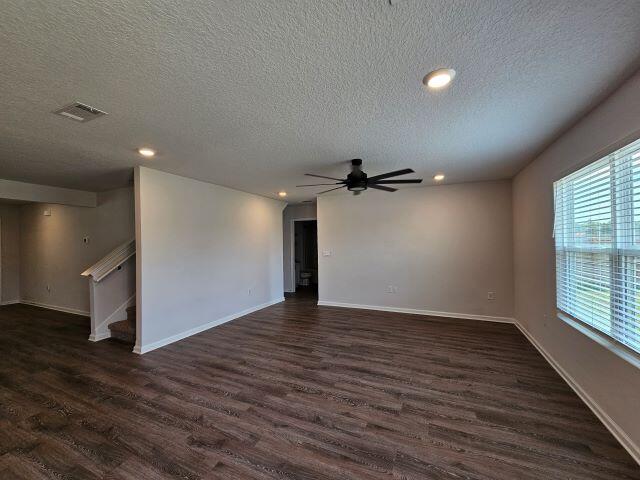 320 Flounder Street Crestview, FL 32539 - Photo 14 of 41 a view of empty room with wooden floor and fan