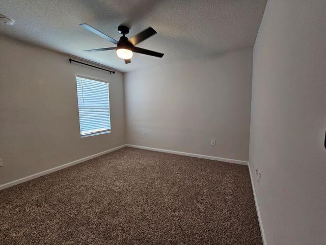320 Flounder Street Crestview, FL 32539 - Photo 34 of 41 an empty room with ceiling fan and windows