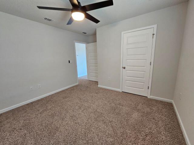 320 Flounder Street Crestview, FL 32539 - Photo 35 of 41 an empty room with closet and a ceiling fan