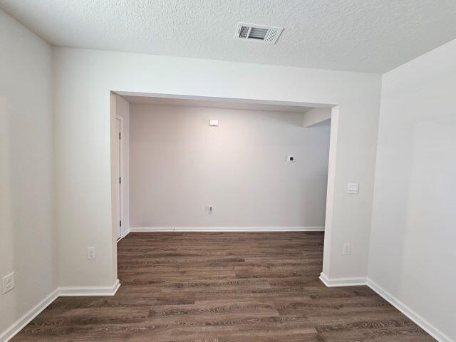 320 Flounder Street Crestview, FL 32539 - Photo 5 of 41 a view of an empty room with wooden floor