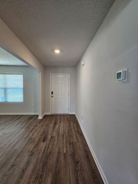 320 Flounder Street Crestview, FL 32539 - Photo 6 of 41 a view of an empty room with wooden floor and closet