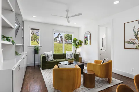 a living room with furniture and a large window