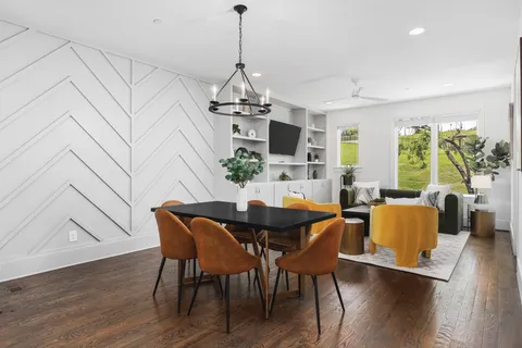 a bathroom with a granite countertop sink toilet and a mirror