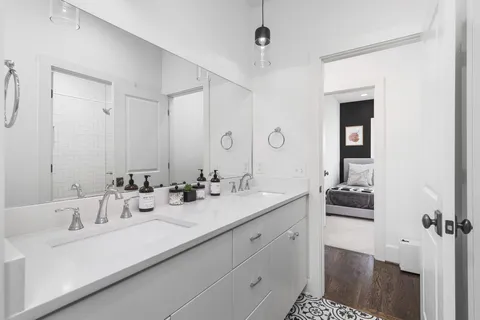 a bathroom with a bathtub and a window