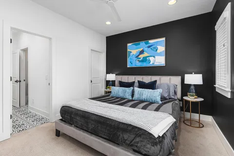 a bedroom with a bed and window