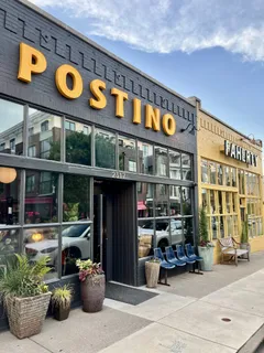 a bedroom with a large bed and a large window