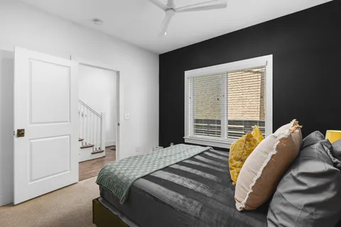 a bathroom with a sink vanity mirror and toilet