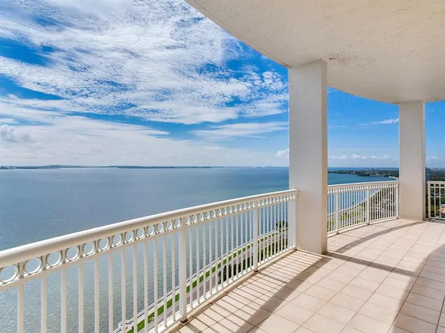 a bathroom with a granite countertop sink a mirror and a shower