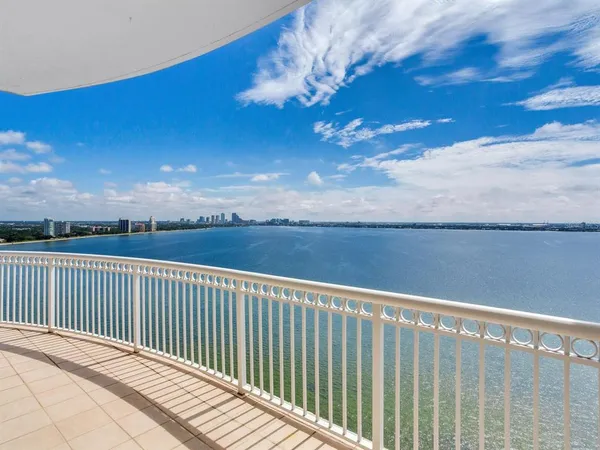 a view of a balcony with wooden floor