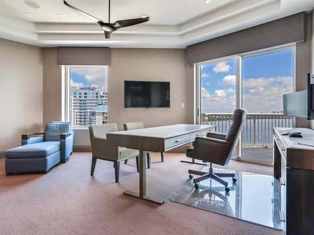 a kitchen with a cabinets and chairs