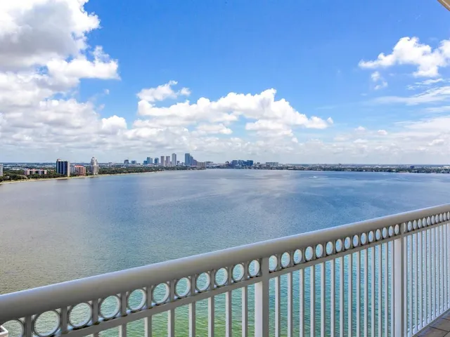 a media room with lots of chairs and a projector screen