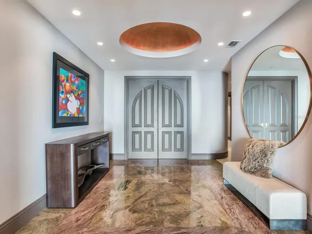 a living room with furniture and large window