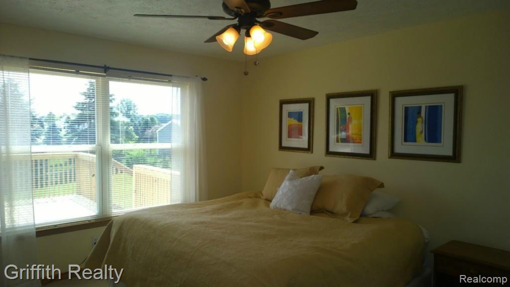 736 Fowlerville Road Fowlerville, MI 48836 - Photo 14 of 84 Master Bedroom. Decking in the background.