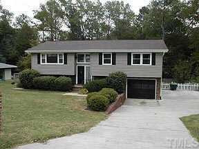Recent updates include low maintenance vinyl siding and windows in this 4 bedroom home with 1 car garage and oversized driveway. Exterior Front
