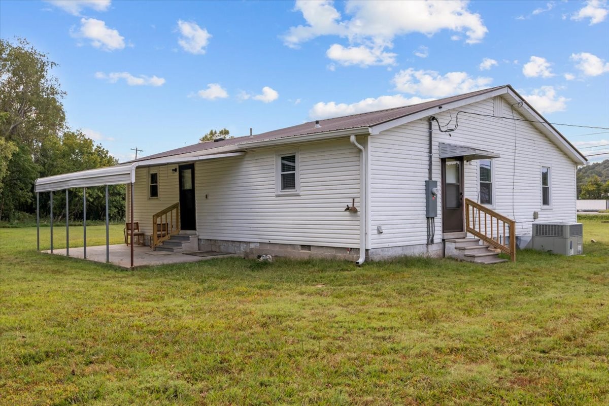 5587 Highway 70 Waverly, TN 37185 - Photo 26 of 32 a view of a house with a yard and sitting area