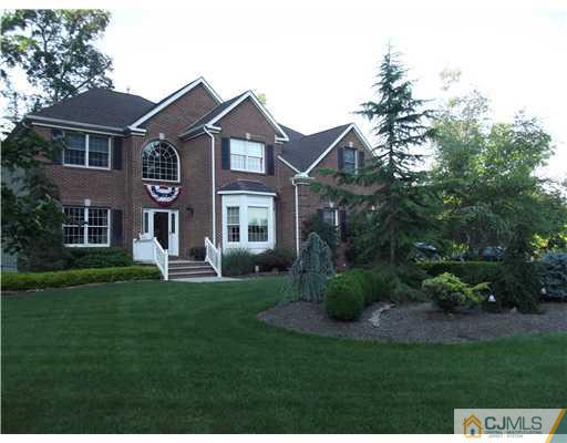 1 Cutter Court Cream Ridge, NJ 08514 - Photo 1 of 25 a front view of a house with a garden