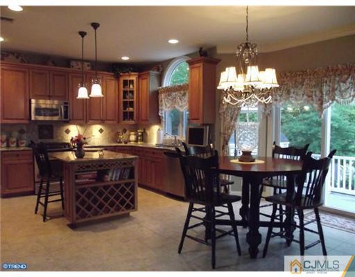 1 Cutter Court Cream Ridge, NJ 08514 - Photo 11 of 25 a dining room with furniture a chandelier and window