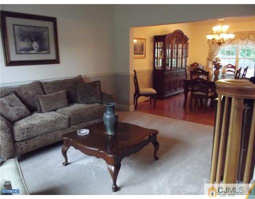 1 Cutter Court Cream Ridge, NJ 08514 - Photo 12 of 25 a living room with furniture a dining table and a piano